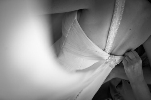 Take your time for trying on your wedding dress - Photo credit: Adrian Tomadin